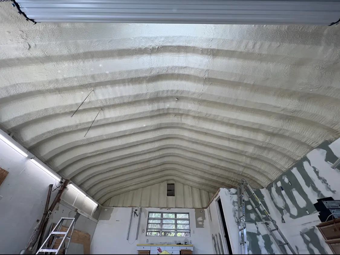 Spray polyurethane foam applied to the underside of a metal roof deck in Coronado